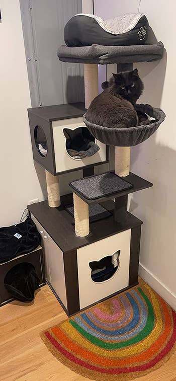 Reviewer image of cat tree with cat sitting on top of it