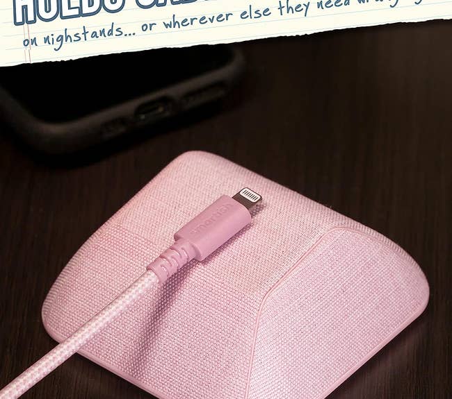 a pink gadget that magnetically holds wires in place