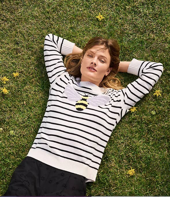 black and white striped sweater with large bumble bee