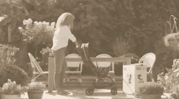 gif of a model showing how the stroller self folds