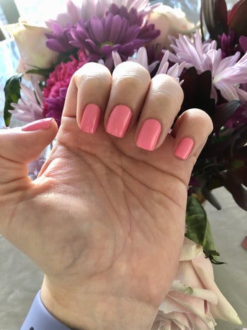 buzzfeed editor wearing a pink nail polish