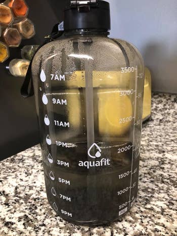 a gallon water bottle jug in black