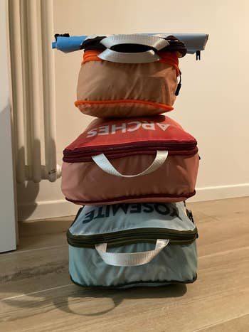 a stack of three packing cubes