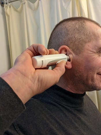 the reviewer using an ear hair trimmer