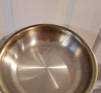 reviewer before photo of a stained metal pan