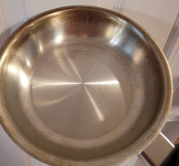 reviewer before photo of a stained metal pan
