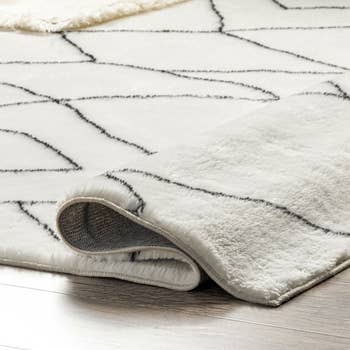 a close up of a white shag rug