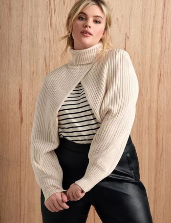 model wearing the cream sweater