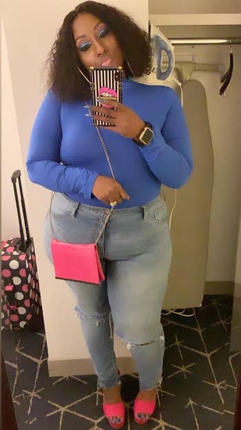 another reviewer wearing the same bodysuit in a blue color with jeans