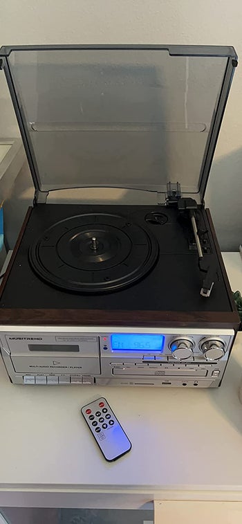 Reviewer image of product with clear lid open and record player empty