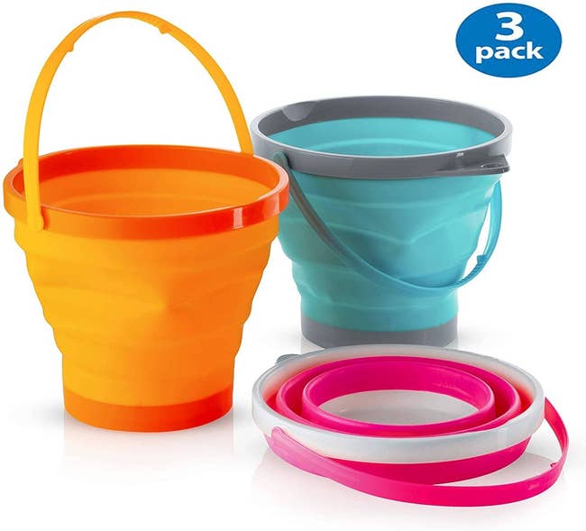 three collapsible sand buckets