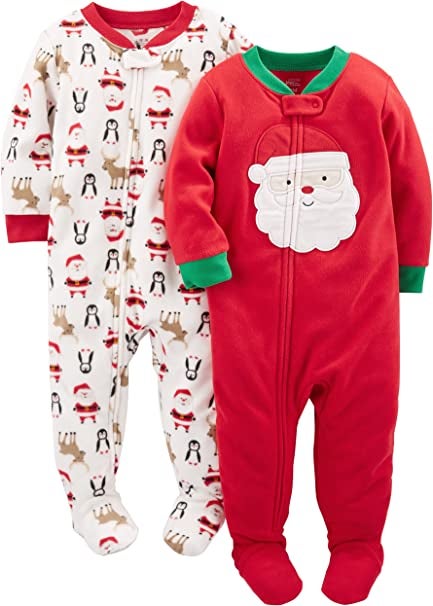 a white fleece footed pajama with a print of reindeer, santa, and a penguin on it and an all red one with santa in the middle