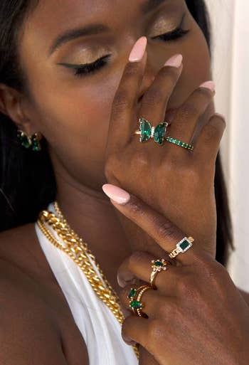 model wearing ring stacked with other rings