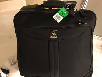 reviewer's garment bag fully zipped up on a counter