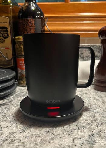 Black version lit up to warm a mug 