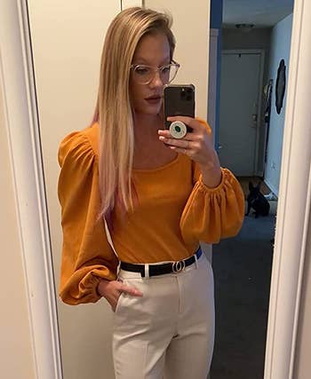 reviewer wearing the top in a mustard color