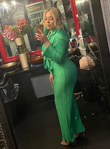 full-length side view of reviewer wearing the green pants set
