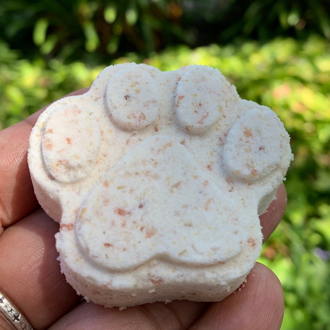 A person holding the bath bomb