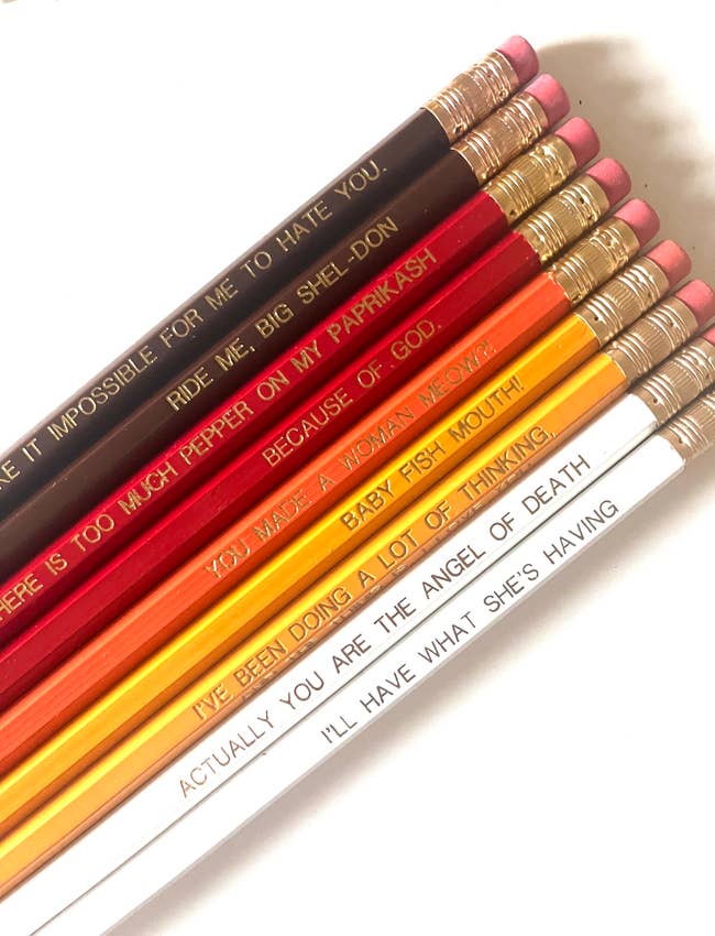 nine fall-hued pencils with phrases from when harry met sally on them in gold foil