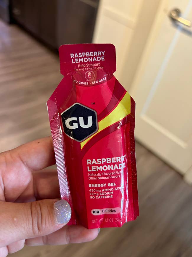 ciera holding up Gu raspberry lemonade energy gel