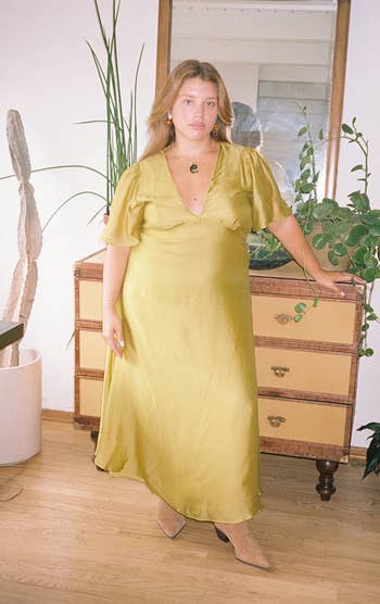 a model posing in the chartreuse dress