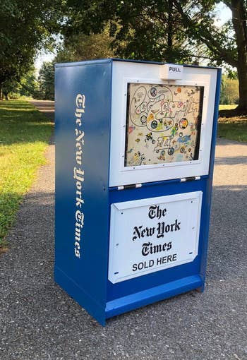 refurbished New York Times newspaper box holding Led Zepelin record