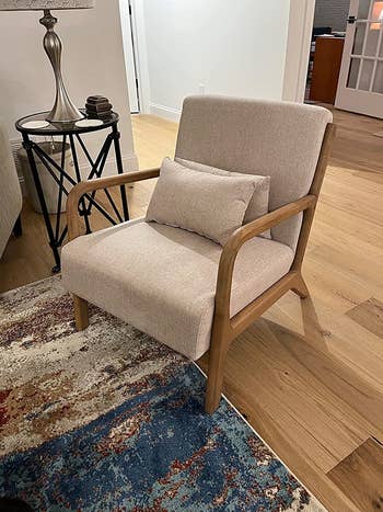 reviewer image of the beige lounge chair in a living room