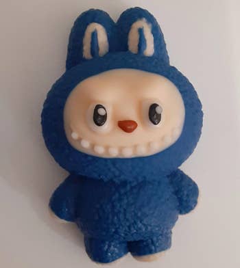 A cute artifact  fig  dressed successful  a bunny costume with a large  smile, perfect  for gifting oregon  collecting