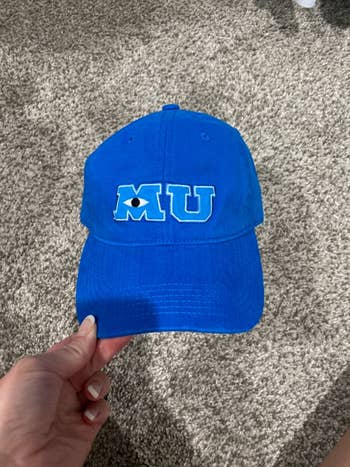 a reviewer's blue MU hat