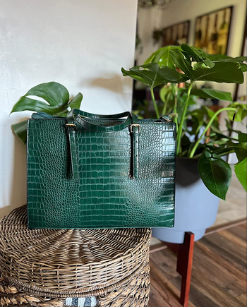 A green faux snakeskin handled bag 