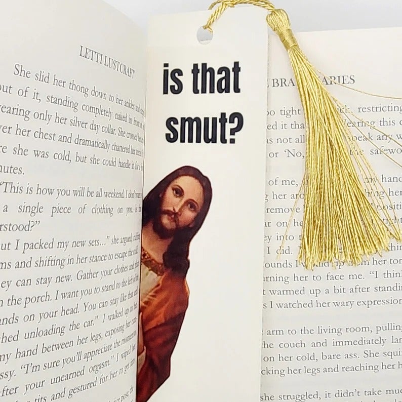 a white bookmark with a gold tassel and an image of jesus on it with the question