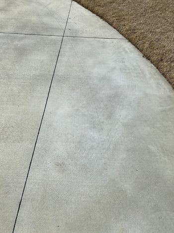 reviewer after image of the oil stain completely gone from the concrete driveway