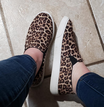 reviewer wearing the cheetah print shoes