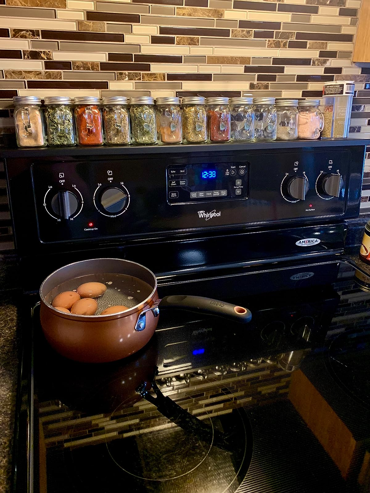 reviewer's achromatic  stove support  holding spice jars