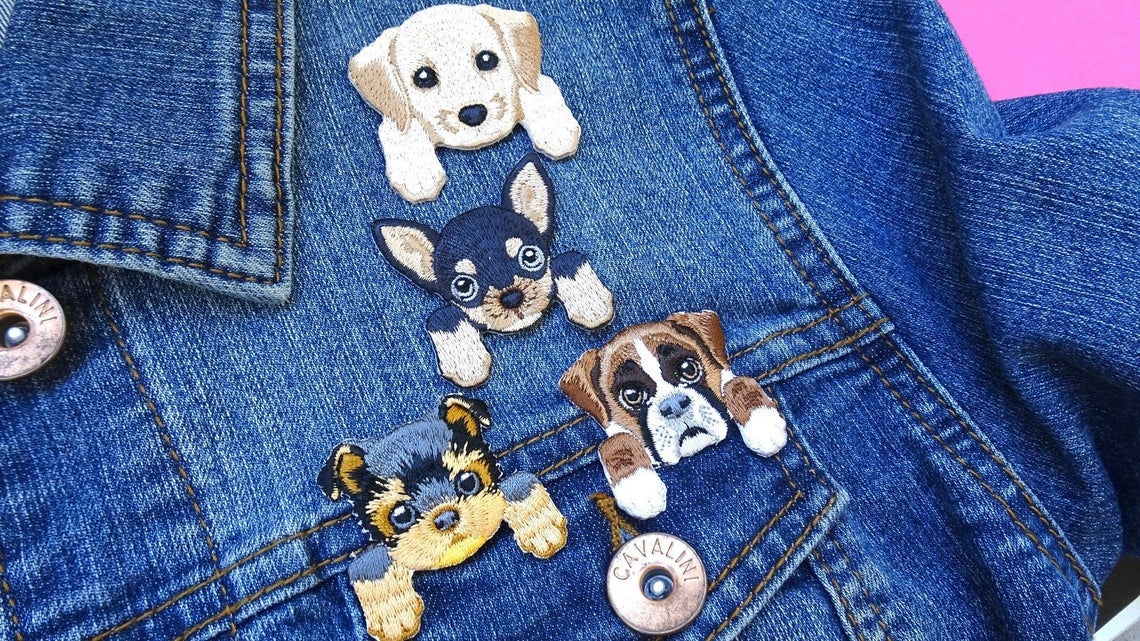 patches shaped like dog faces with front paws