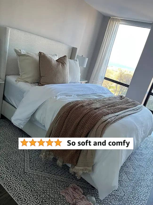 A well-made bed with plush pillows and a cozy throw blanket. A 5-star rating and the text 