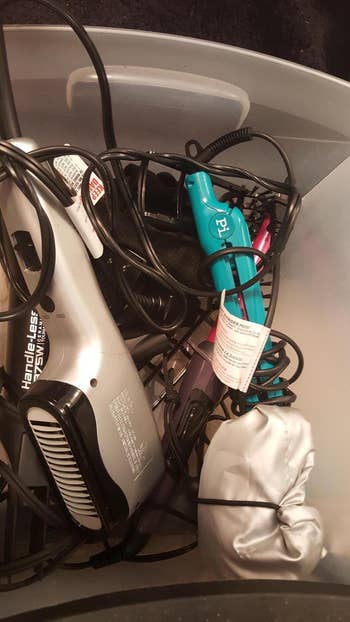 reviewer photo of a bin full of messy hair accessories
