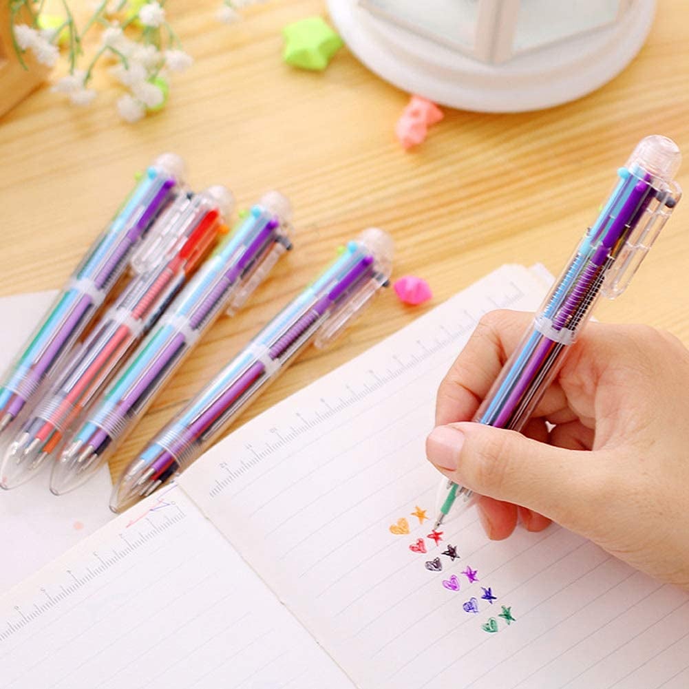 person writing with retractable pen