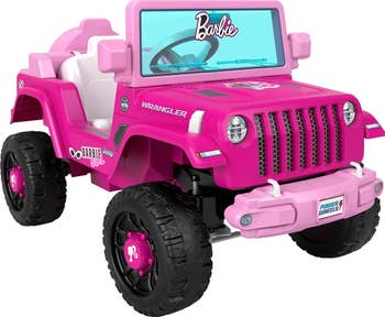 Pink Barbie-themed Power Wheels Jeep Wrangler with iconic logo and design