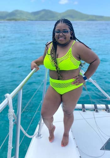 another reviewer wearing neon yellow on a boat