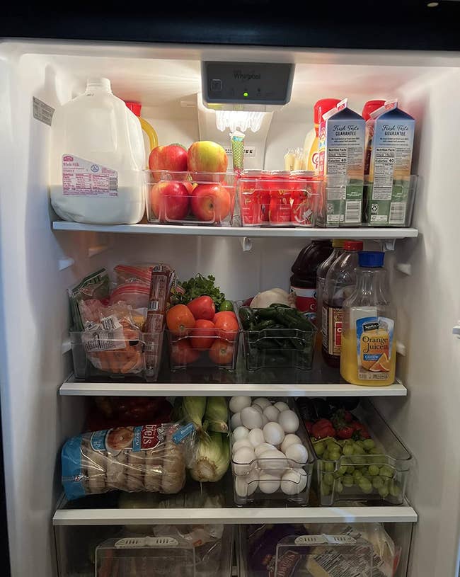a reviewer photo of a fridge organized with the bins 