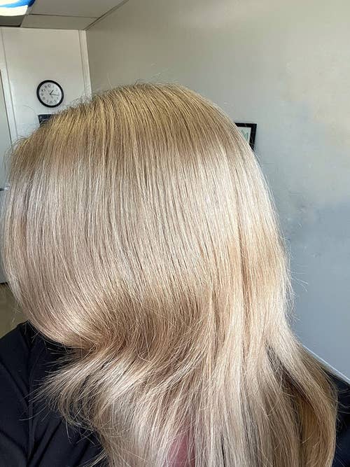 a reviewer with dull, blonde hair before using hair treatment