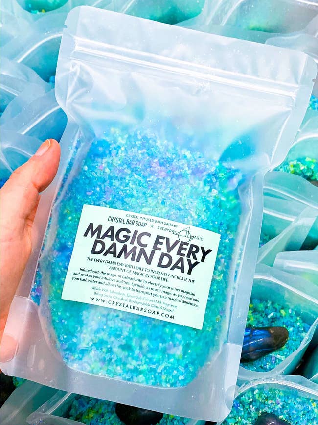 a package of bath salts with various blues and greens in it