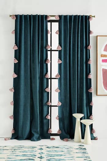 navy blue curtains with pink tassel trim