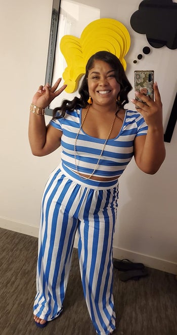 a reviewer photo of someone wearing the set in the blue and white stripe option