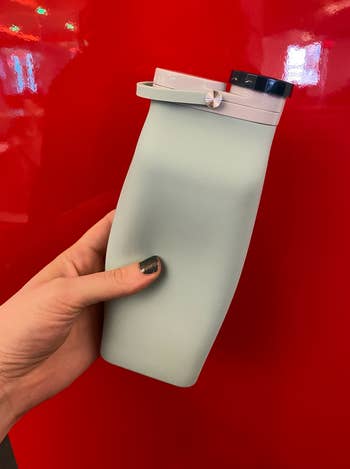 silicone water bottle opened to full capacity