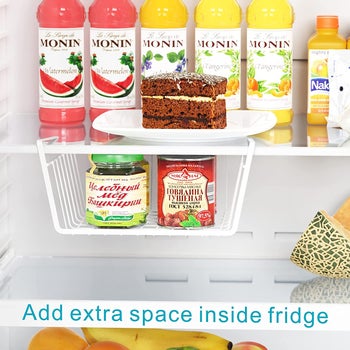 The white shelf hanging in a fridge