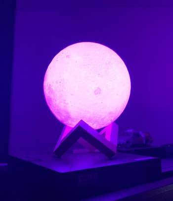 the moon lamp glowing pink