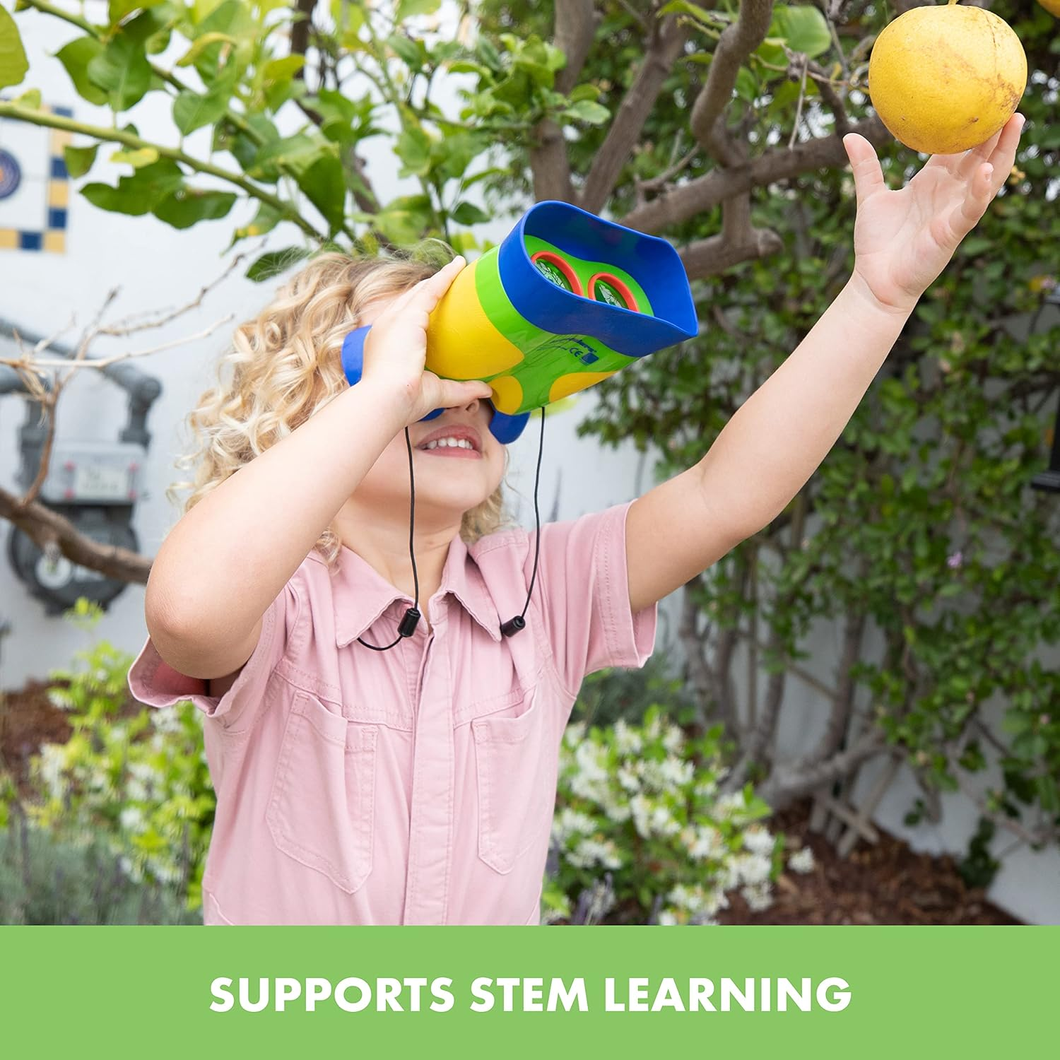 Child utilizing colorful binoculars to scope   for a effect   connected  a histrion   branch