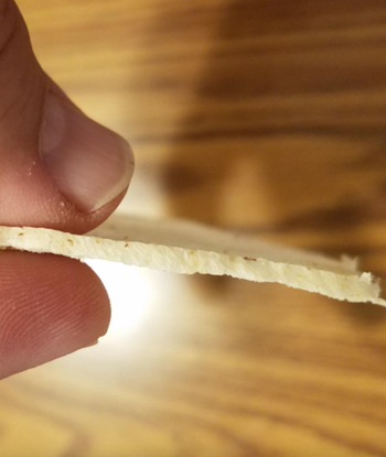 Reviewer image of very thinly sliced piece of bread 